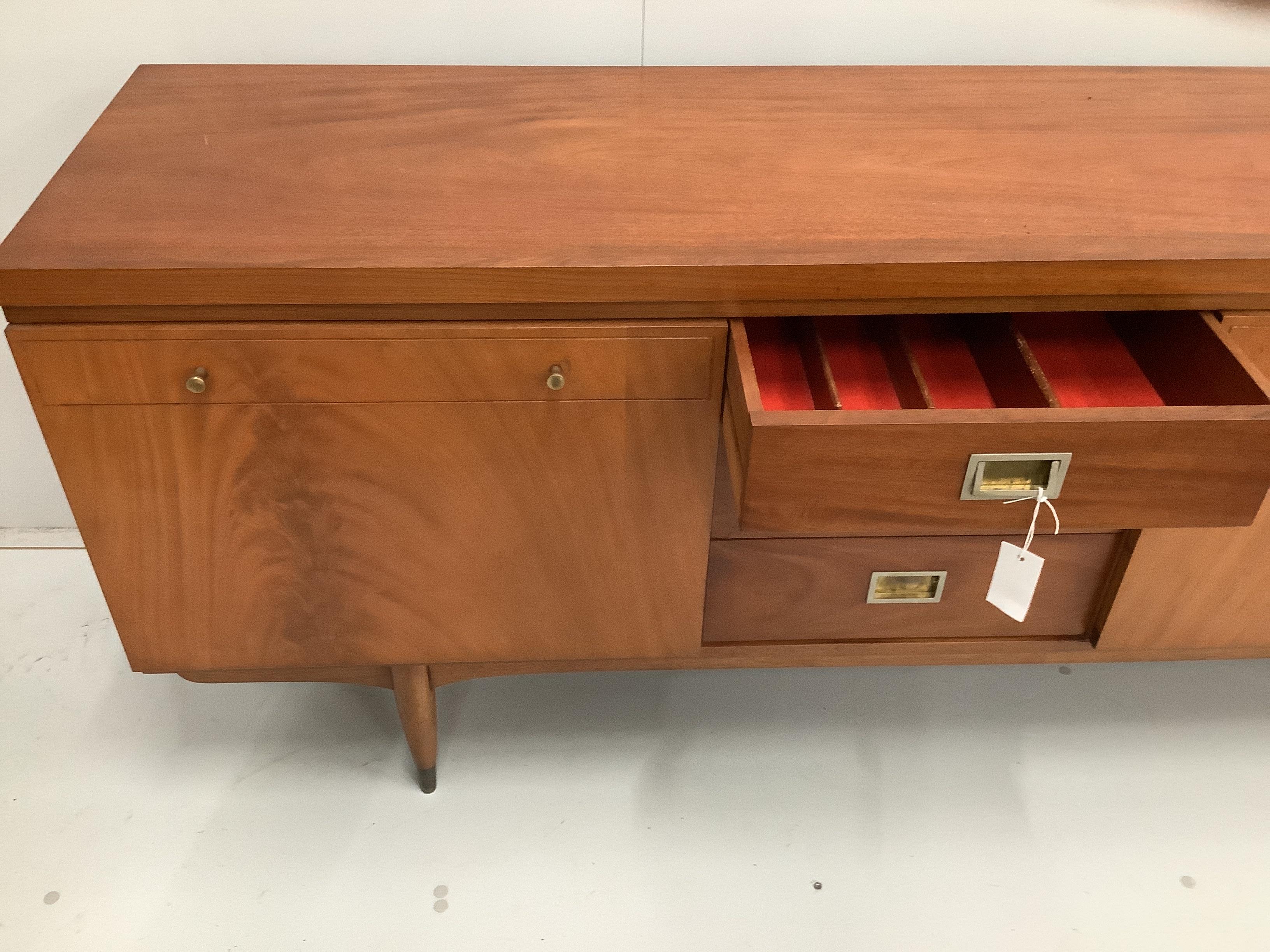 A Greaves and Thomas mid century teak sideboard, width 220cm, depth 45cm, height 76cm